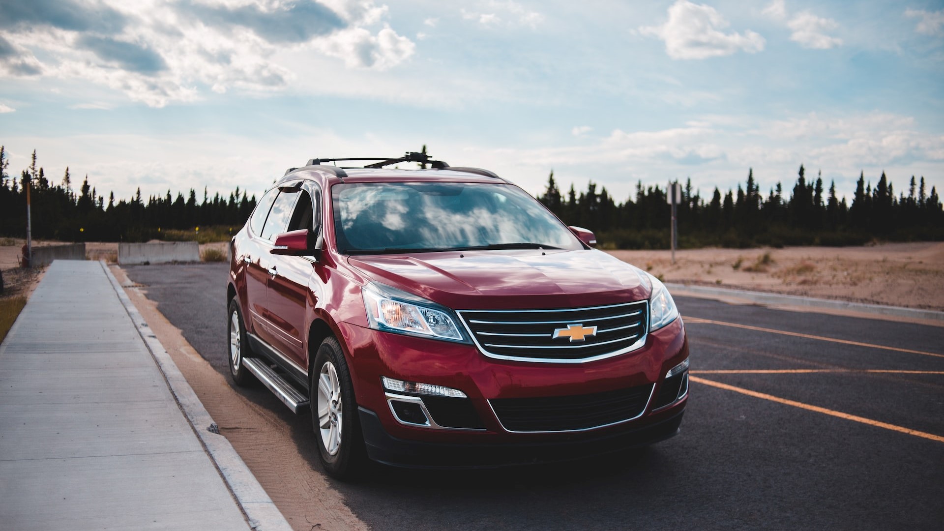 Red SUV parked on road | Goodwill Car Donations