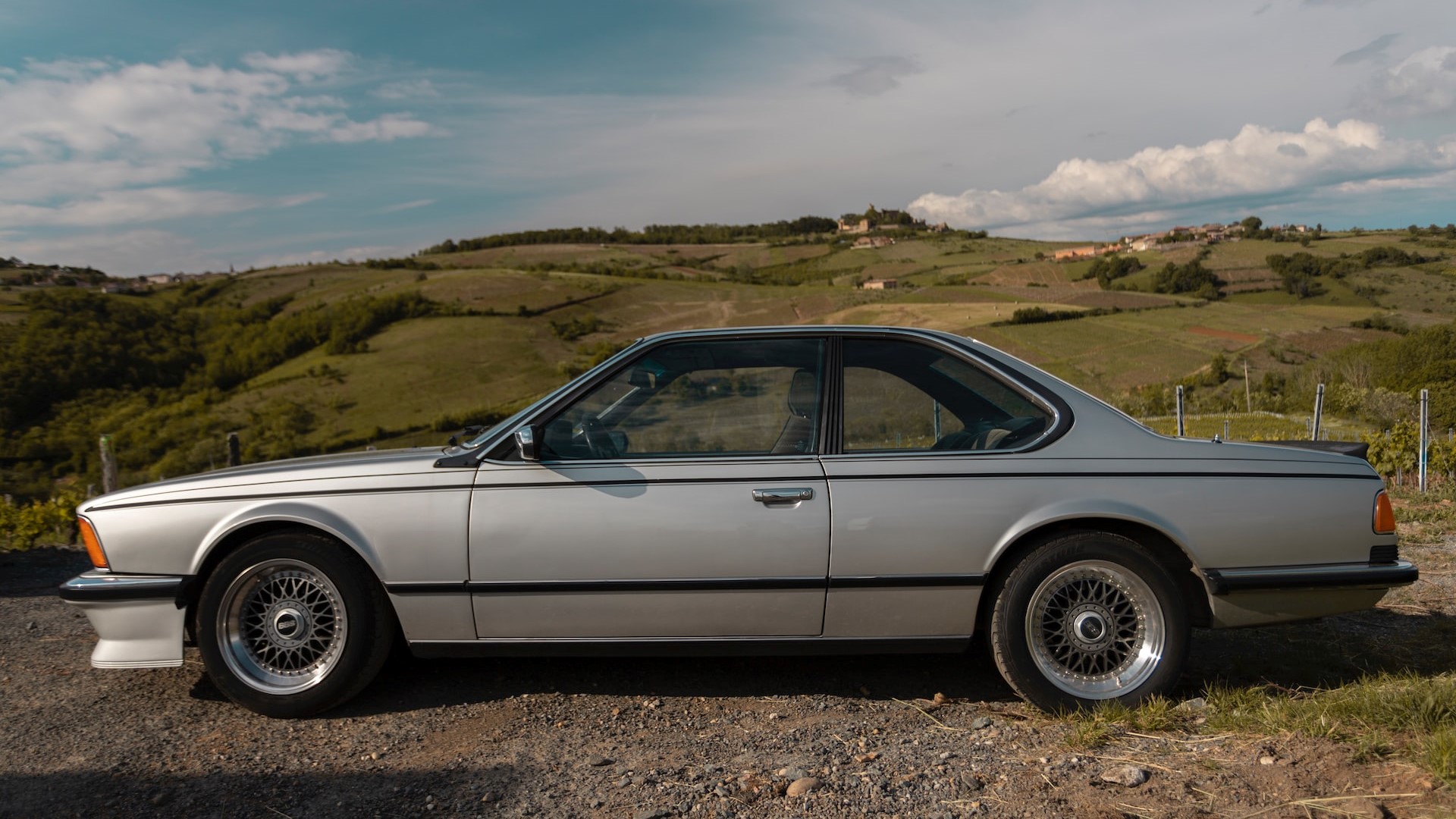 Silver Coupe parked on mountain | Goodwill Car Donations
