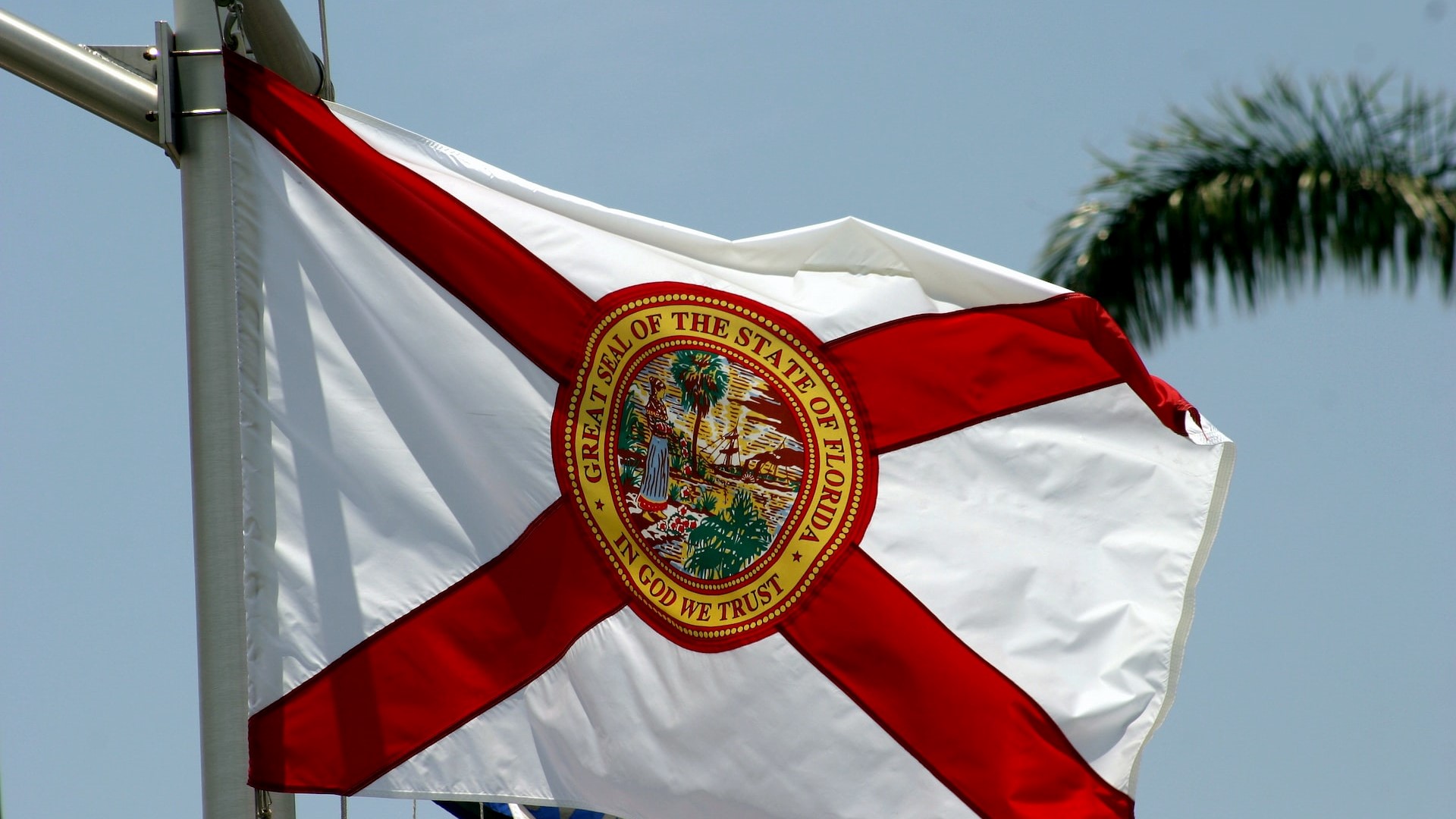 The state flag of Florida flies on a ship's mast | Goodwill Car Donations