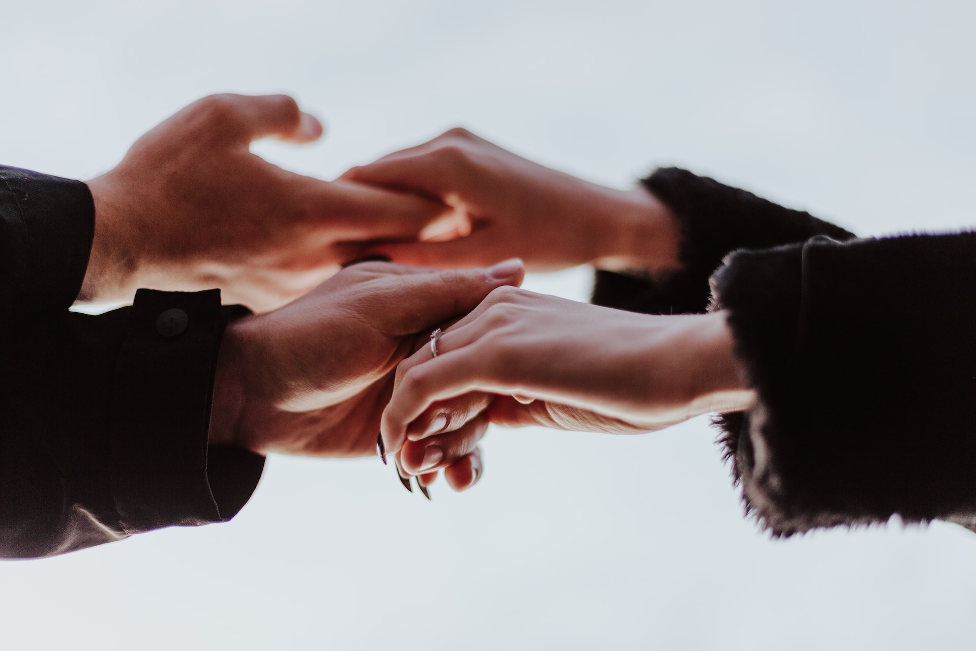 Two people holding hands| Goodwill Car Donations