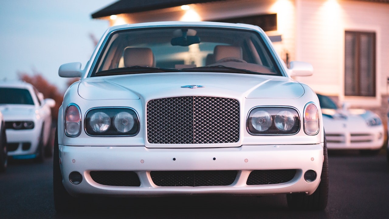 White Bentley Car in a Parking Lot | Goodwill Car Donations