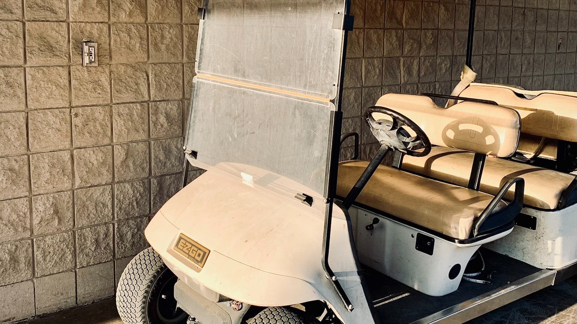 White dusty golf cart parked | Goodwill Car Donations