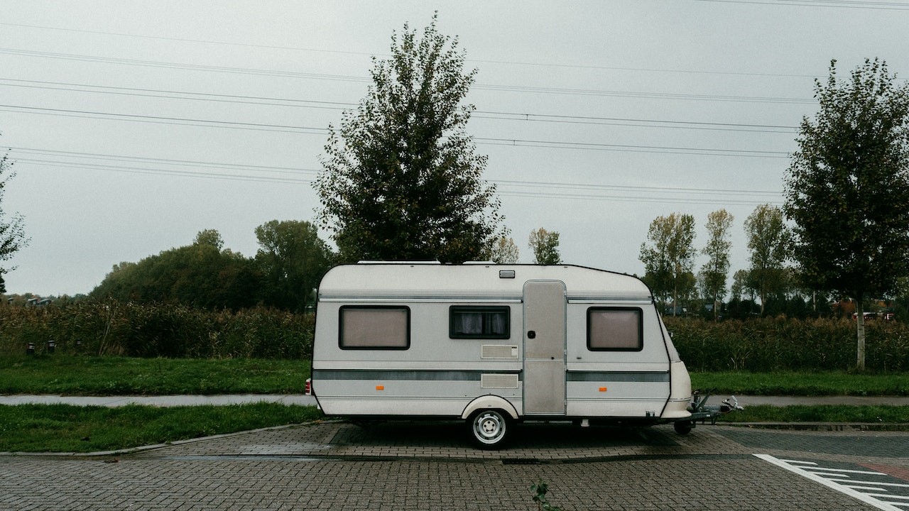 White travel trailer parked | Goodwill Car Donations