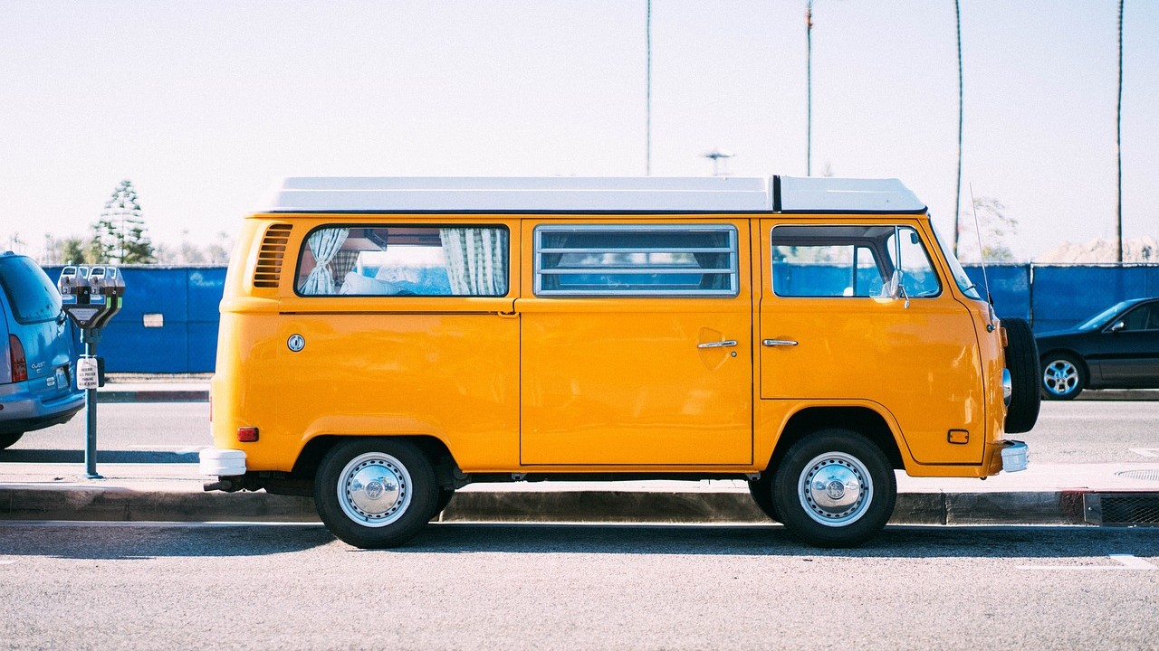 Yellow van parked on the side of the road | Goodwill Car Donations