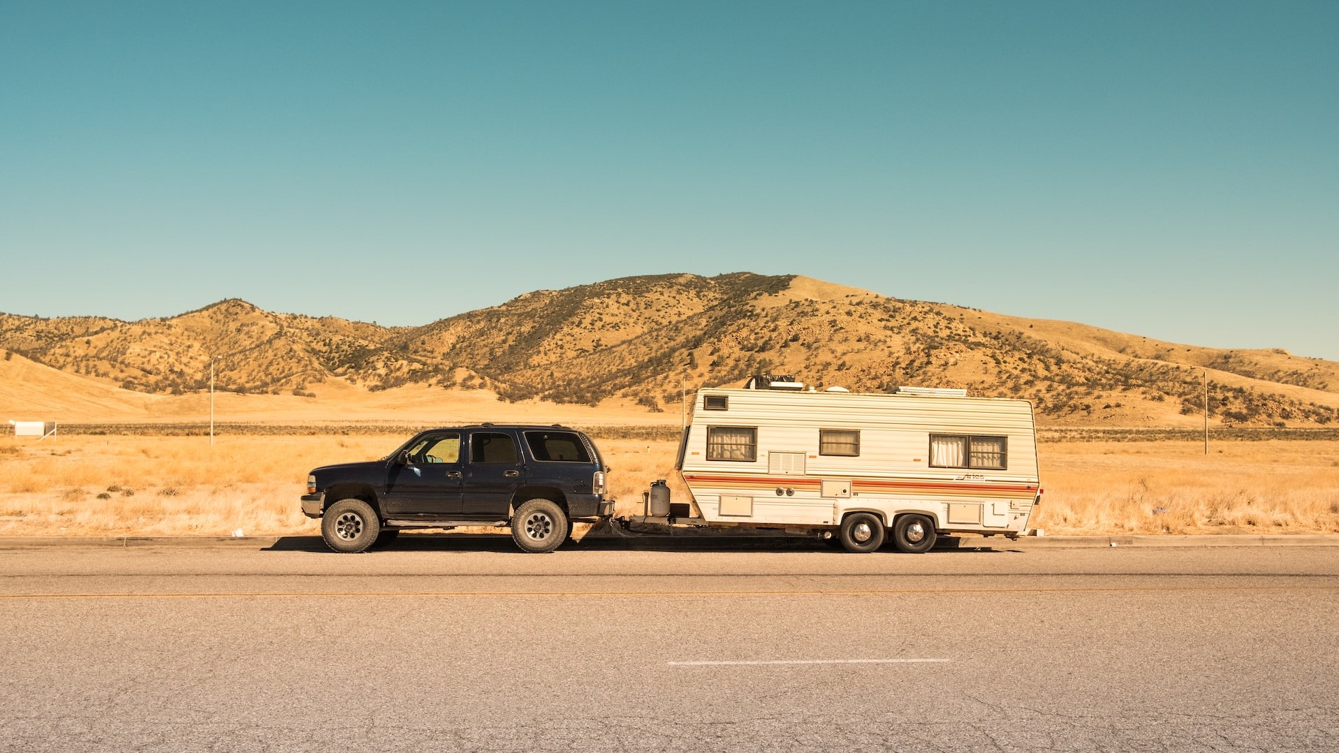 black SUV and white trailer photo | Goodwill Car Donations