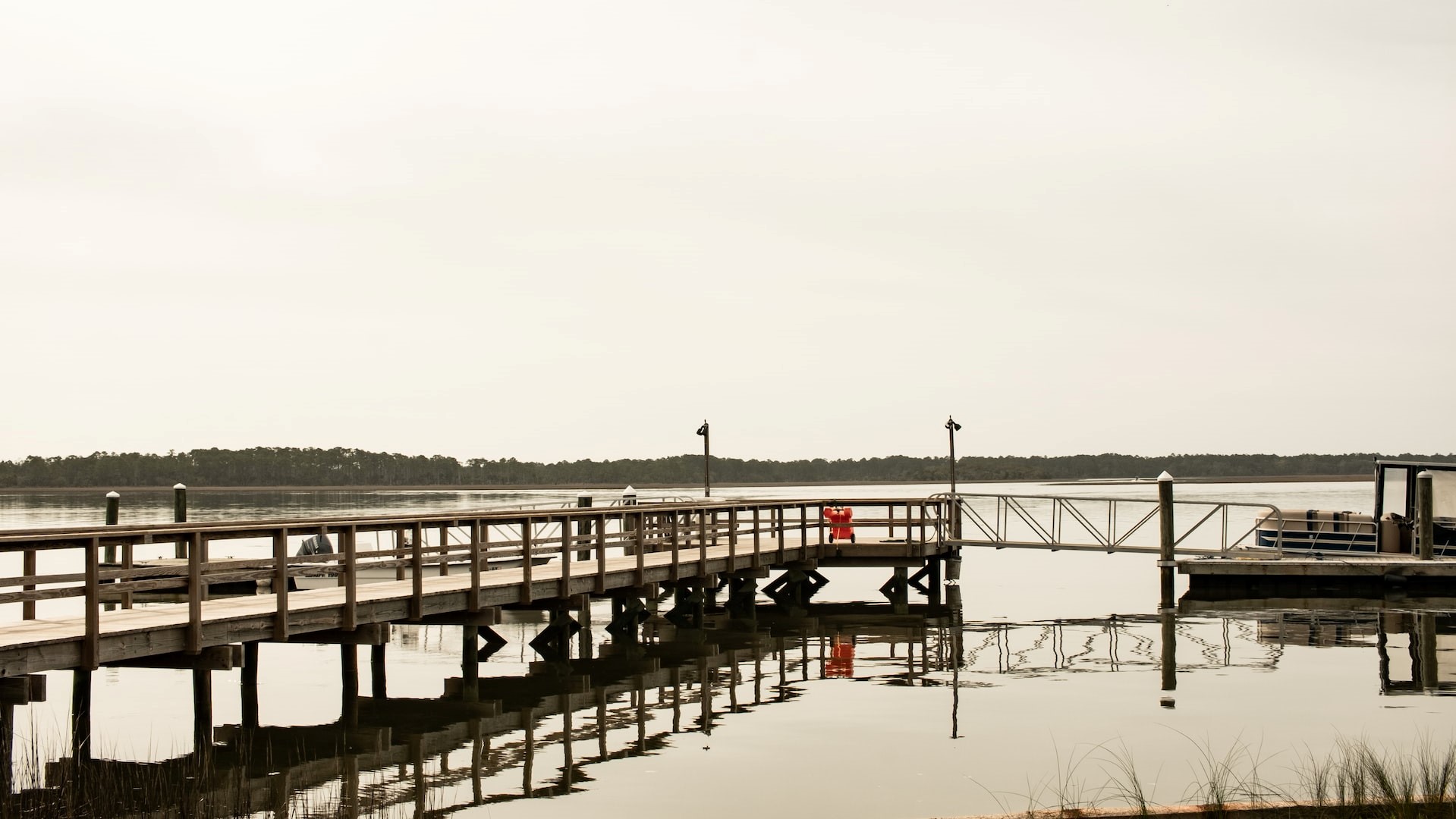 brown wooden dock on body of water during daytime photo | Goodwill Car Donations