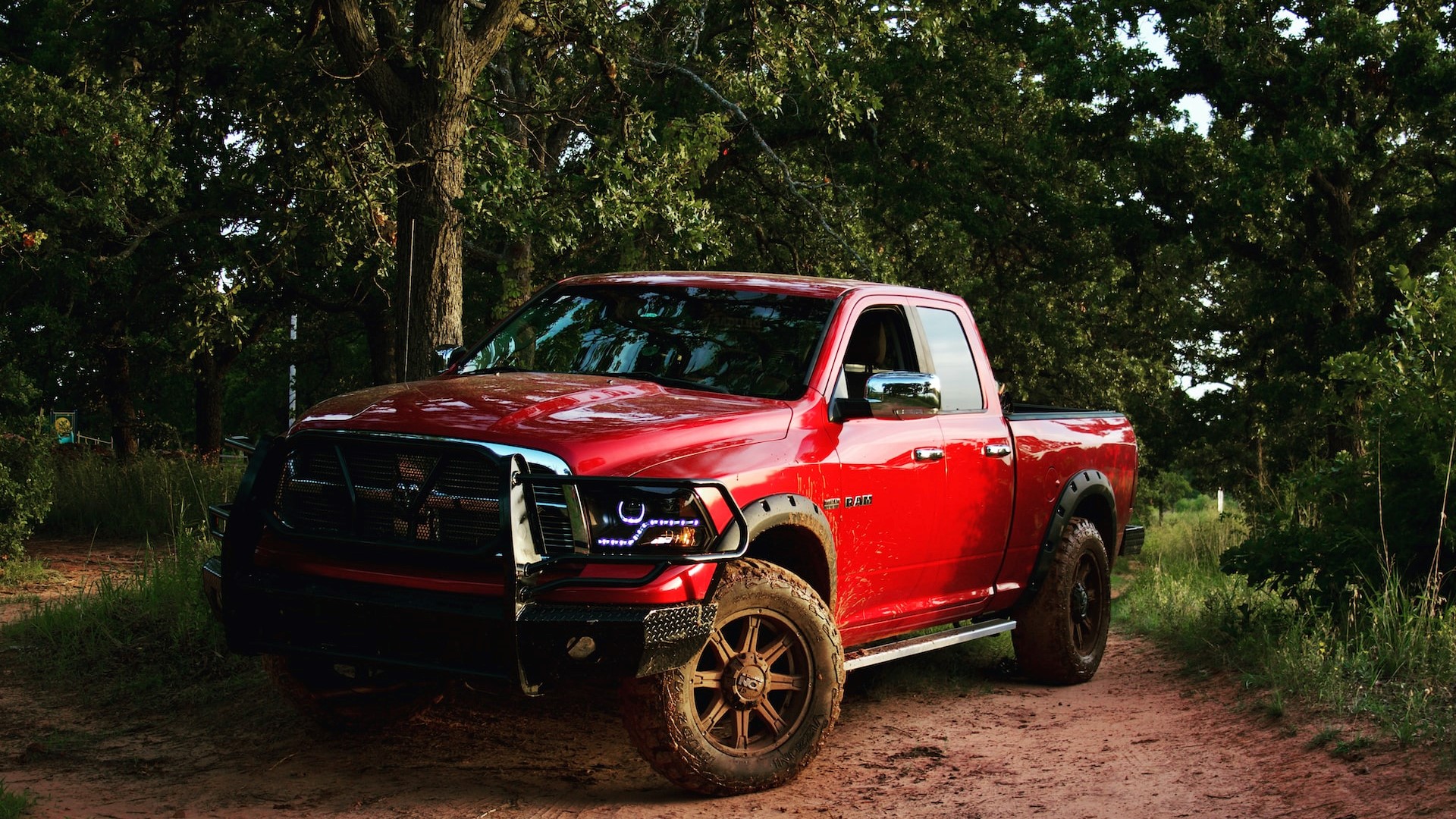 red checrolet single cab pickup truck parked beside green trees | Goodwill Car Donations