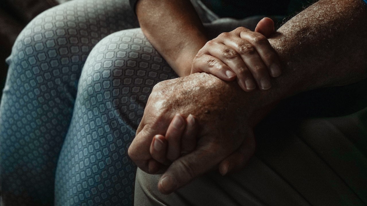 A Close-Up Shot of People Holding Hands | Goodwill Car Donations