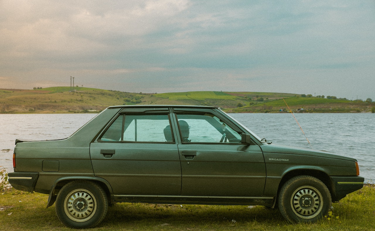 A Side View of a Parked Car on the Grass | Goodwill Car Donations