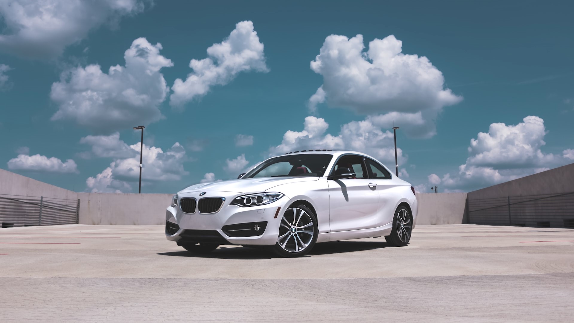 Parked White BMW Coupe | Photo by Lesli Whitecotton under Pexels License