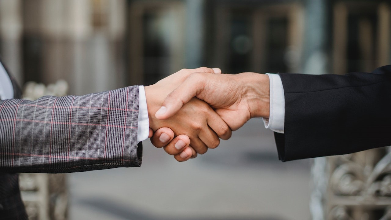 People Shaking Hands | Goodwill Car Donations