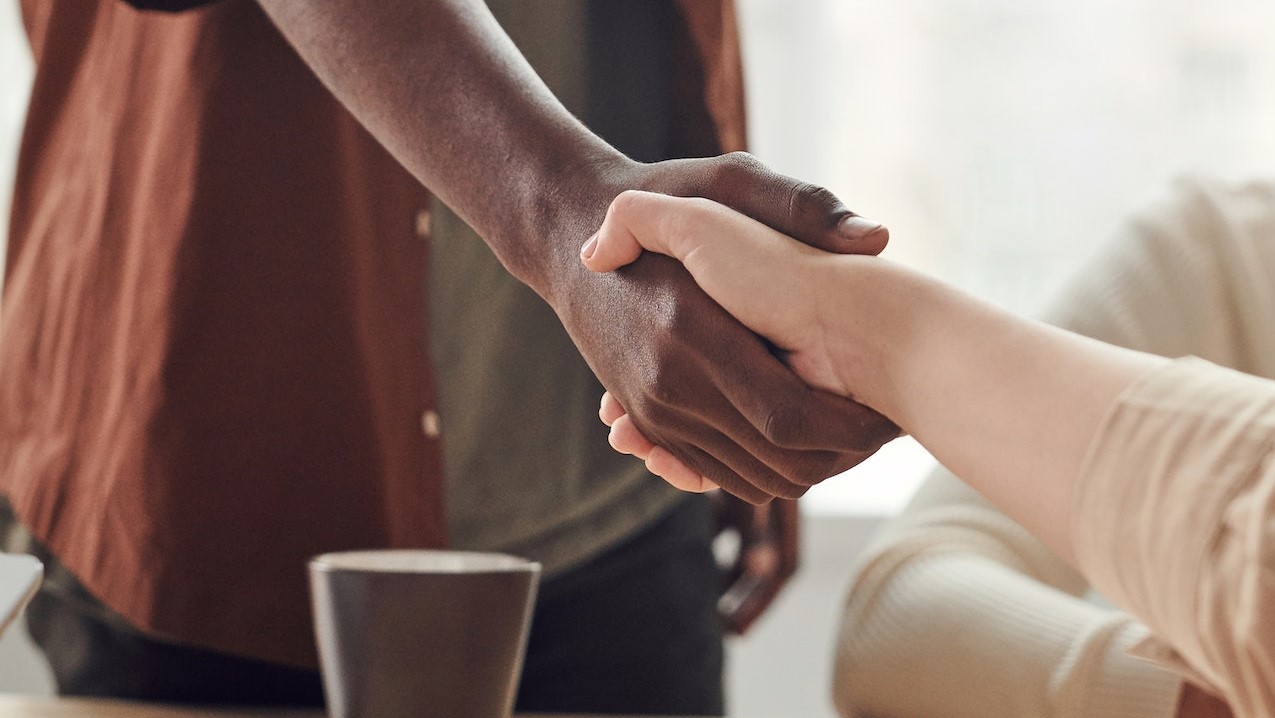 Photo Of People Doing Handshakes | Goodwill Car Donations