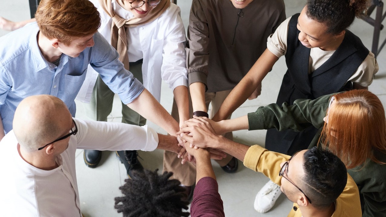 Photo Of People Holding Each Other's Hands  | Goodwill Car Donations