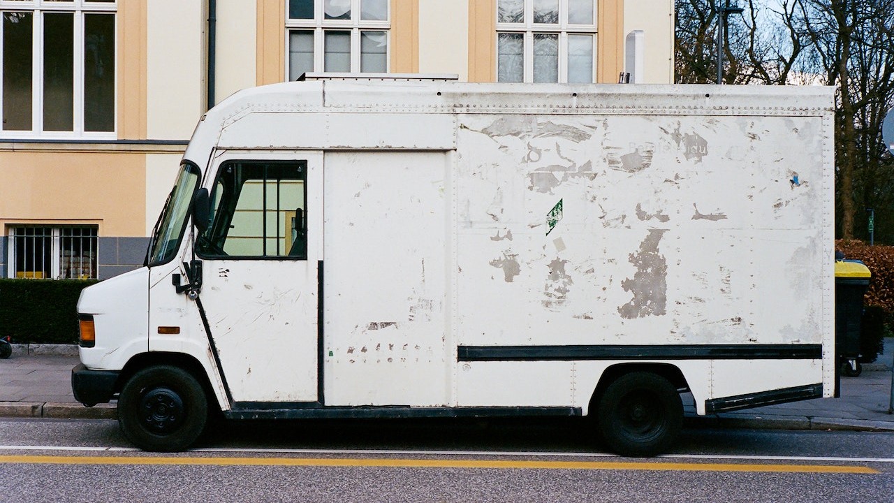 White Delivery Van Parked on Roadside | Goodwill Car Donations