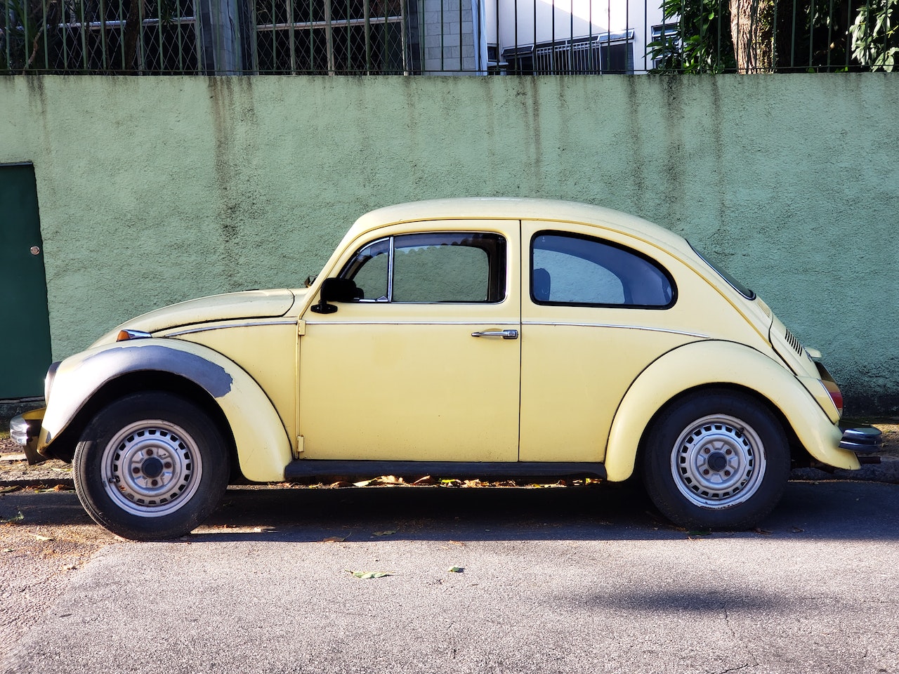 Yellow Volkswagen Beetle Parked on Roadside | Goodwill Car Donations