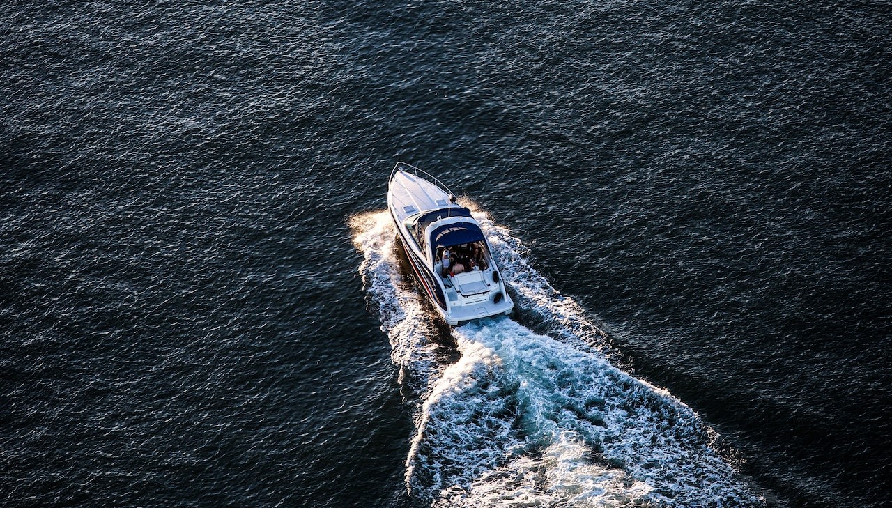 Aerial View of White Boat on Sea | Goodwill Car Donations