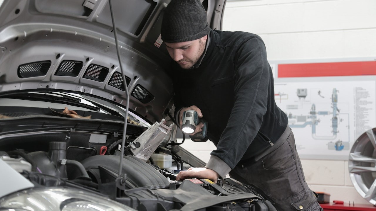 Car mechanic checking the car | Goodwill Car Donations