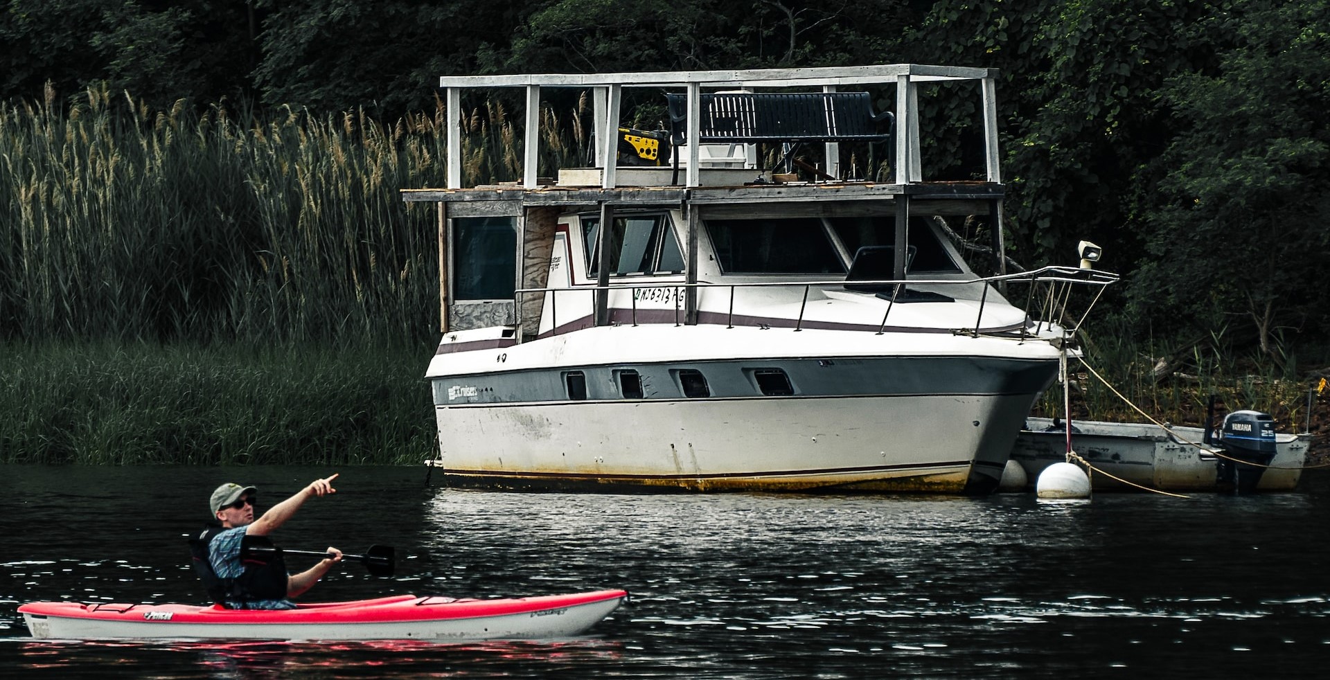 House Boat on a River | Goodwill Car Donations