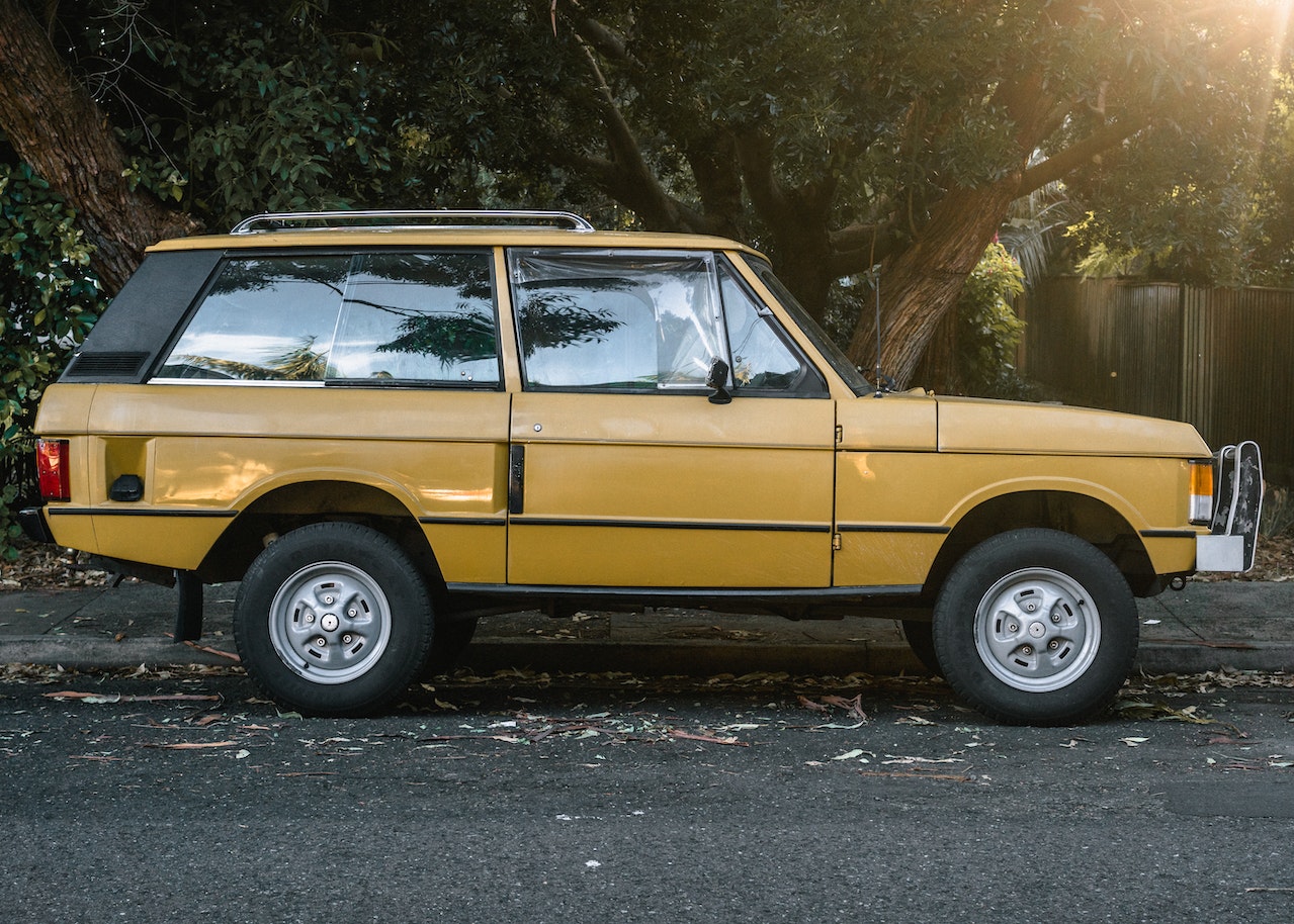 Photo of Parked Old Yellow SUV | Goodwill Car Donations