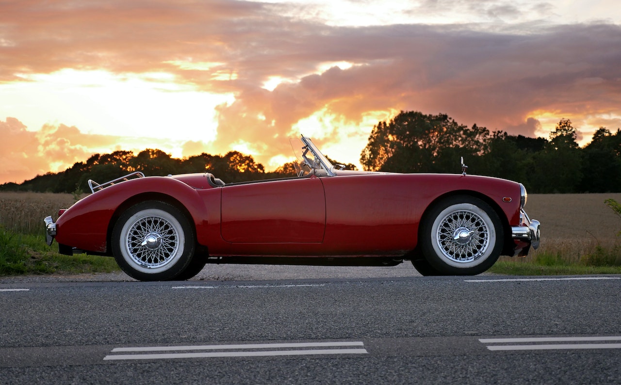 Red Coupe Soft-top on Road | Goodwill Car Donations