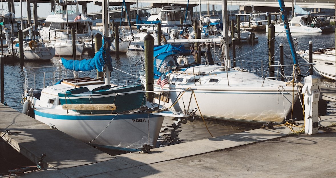 Two Boats Parked Near Bridge | Goodwill Car Donations