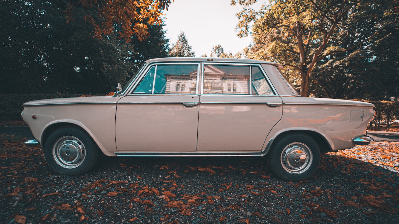 A Gray Vintage Car Parked on the Street | Goodwill Car Donations