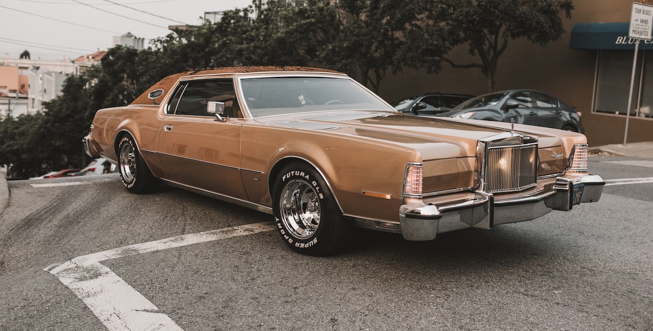 Brown Coupe Parked on Parking Lot | Goodwill Car Donations