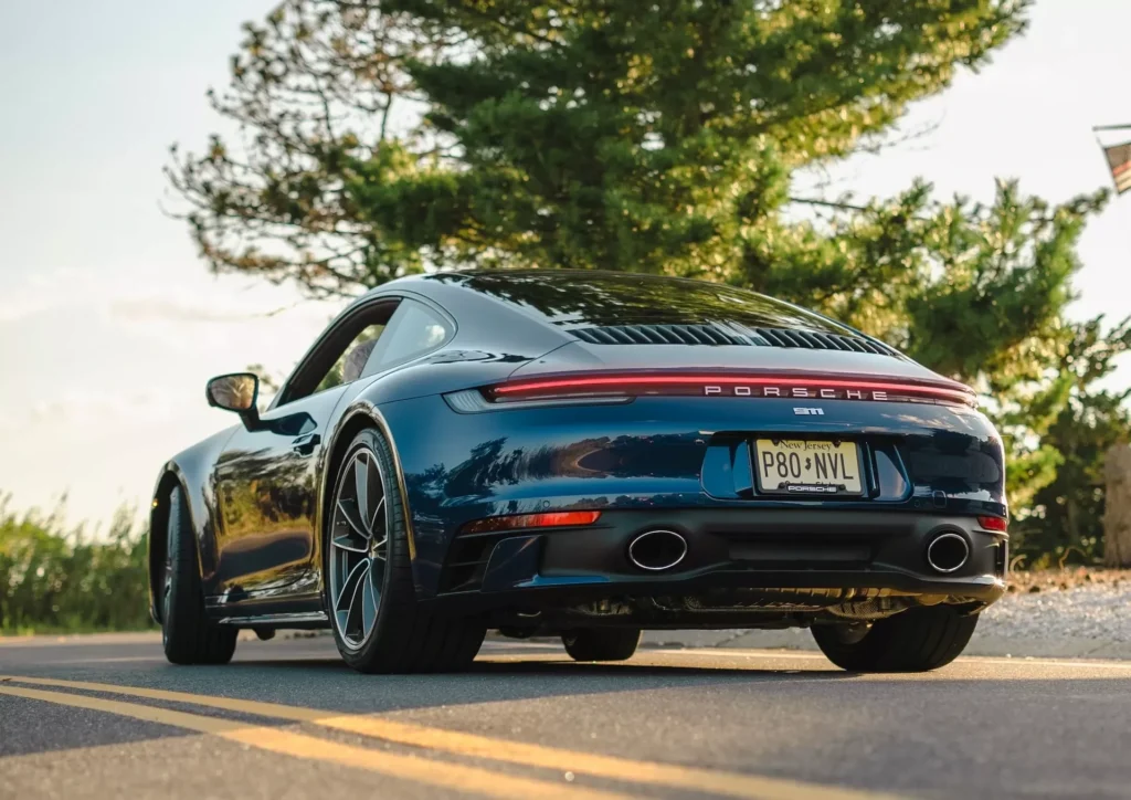 A sports car driving down the road