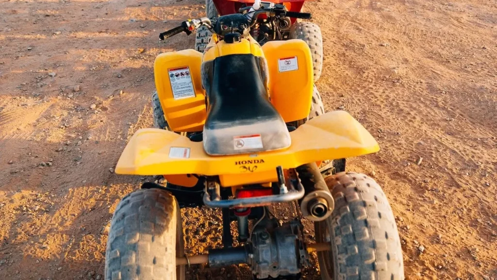 A lineup of ATVs in the Las Vegas desert awaits an off-road adventure tour