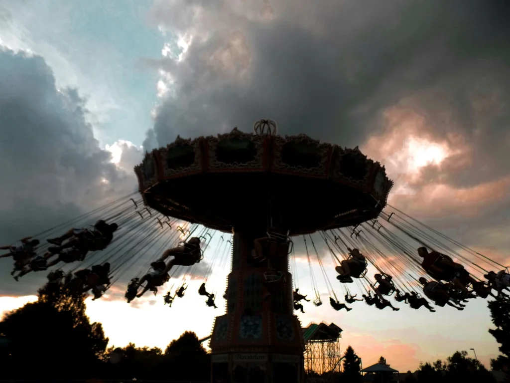 Beige carousel under cumulud clouds