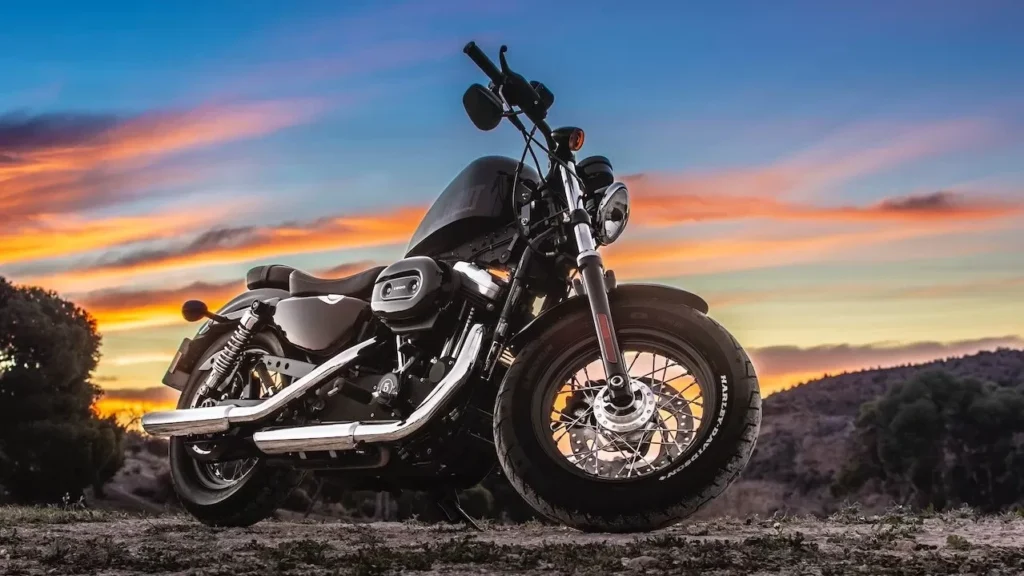 Capture the freedom of riding a motorcycle at sunset on a dirt road
