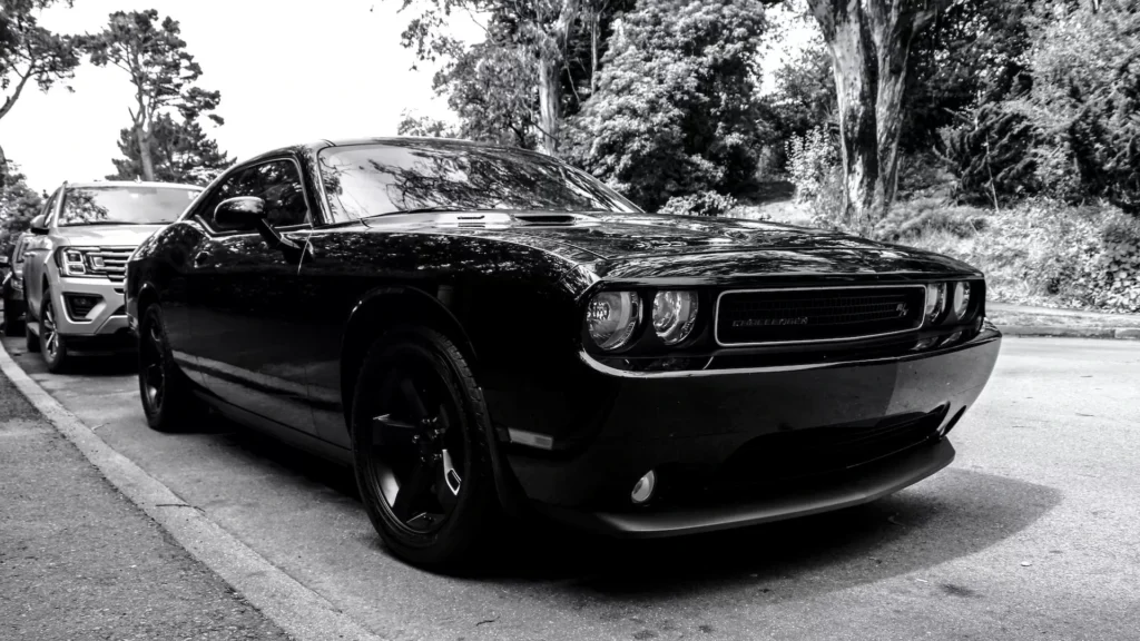 Black Dodge Challenger parked on the street