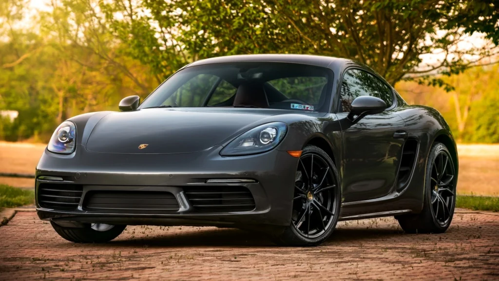 Black Porsche 718 Cayman on road during daytime