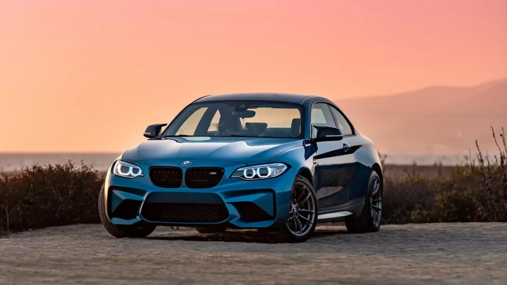 Blue bmw m 3 on road during daytime