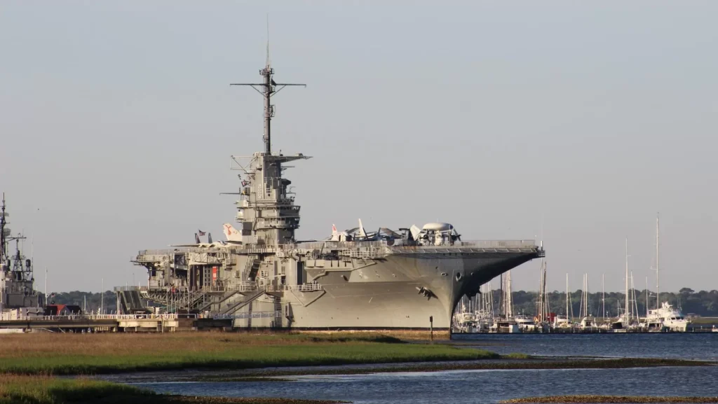 gray ship on sea under gray sky during daytime