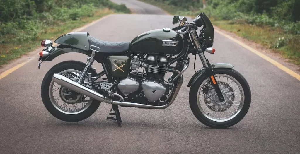 Captured on a tranquil road, a Triumph Thruxton motorcycle promises an adventurous ride