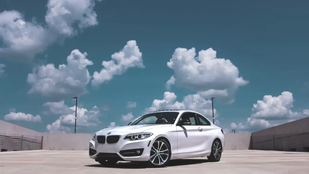 Parked white BMW coupe