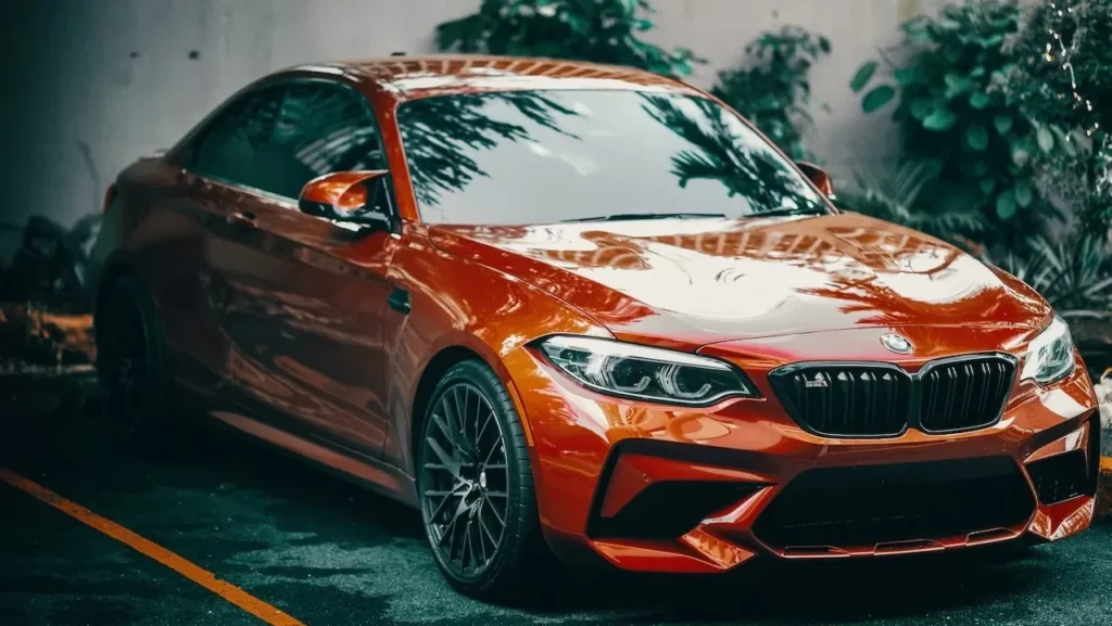 red BMW coupe parked outdoors, showcasing its sleek design and modern appeal.