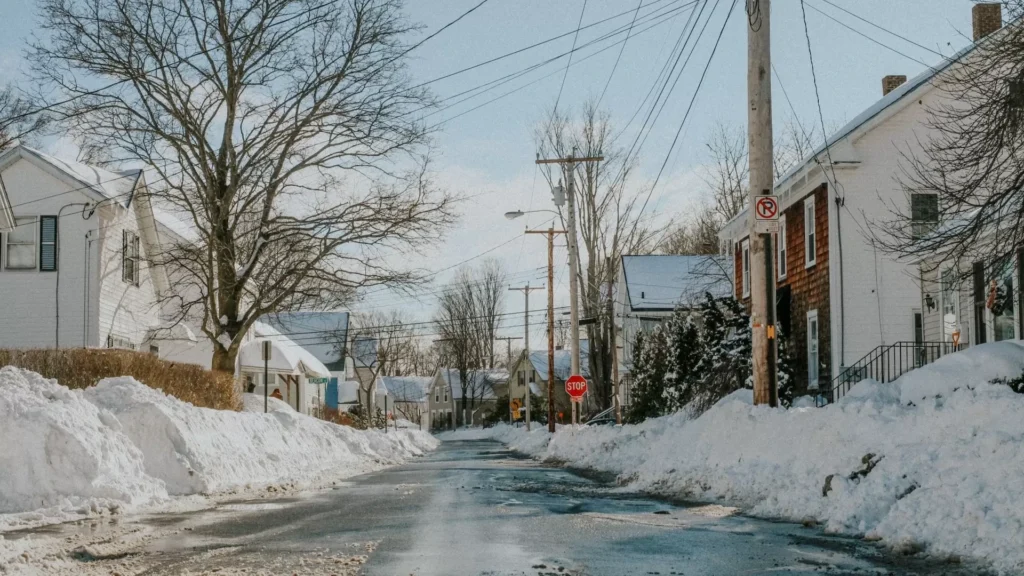 Snow covered road during daytime