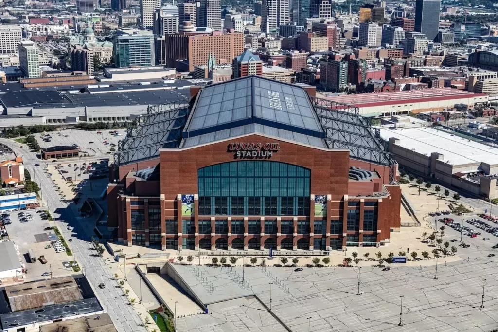 view of Lucas Oil Stadium in Indianapolis, with surrounding cityscape.