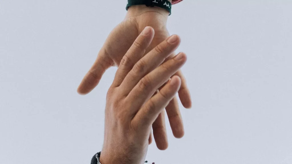 View of two persons hands