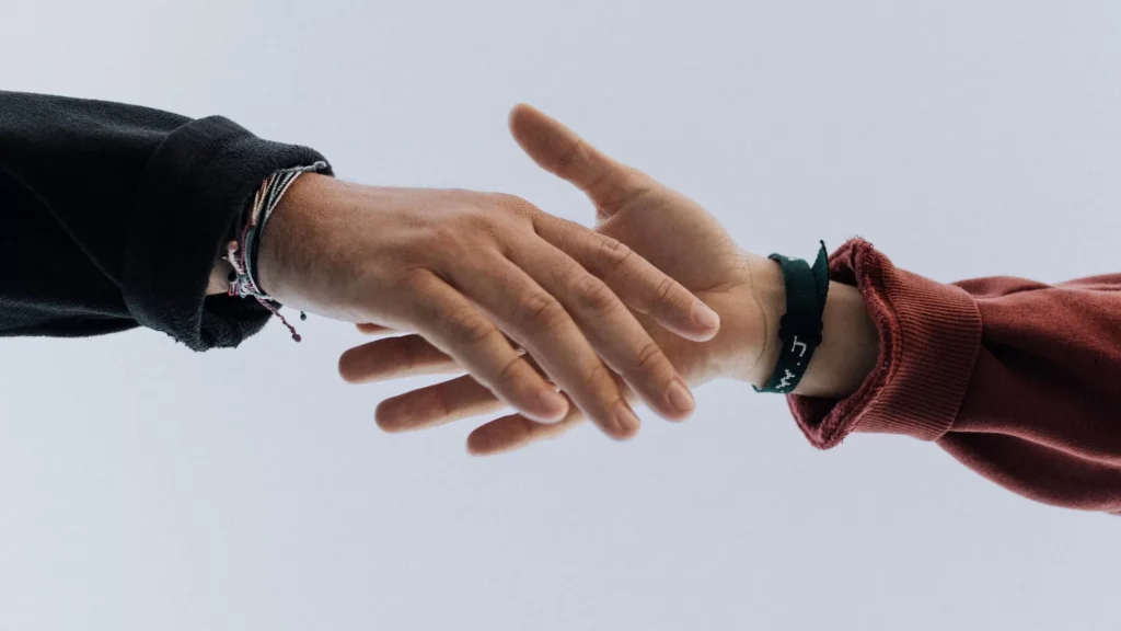 View of two persons hands