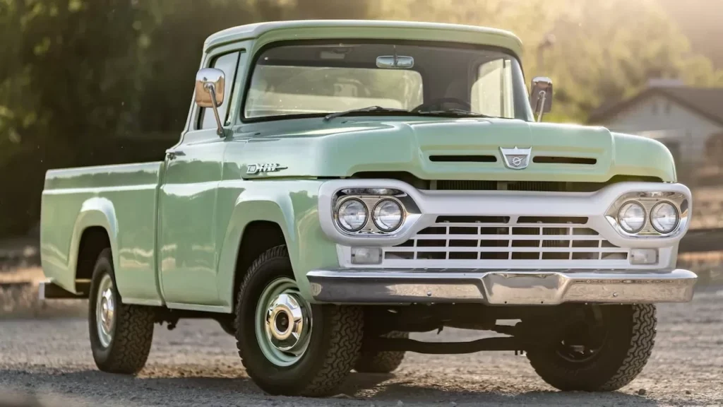 Classic vintage pickup truck parked outdoors with sunlight highlighting its retro design
