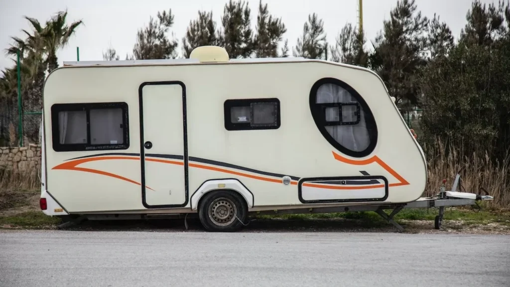 A modern caravan parked outdoors, perfect for travel adventures