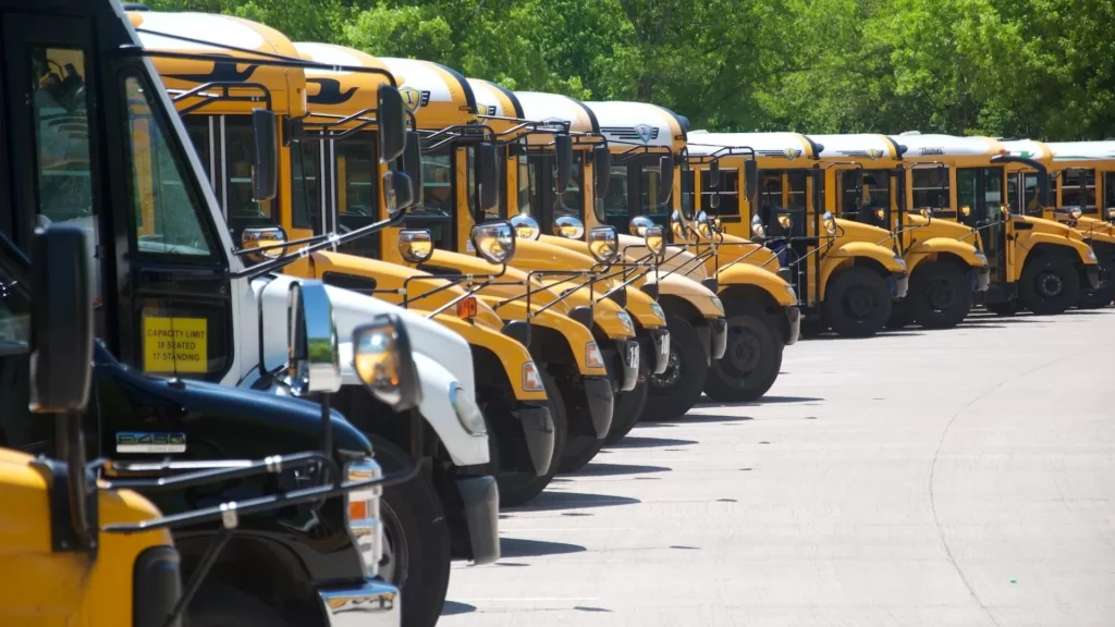 Yellow school bus on road during daytime