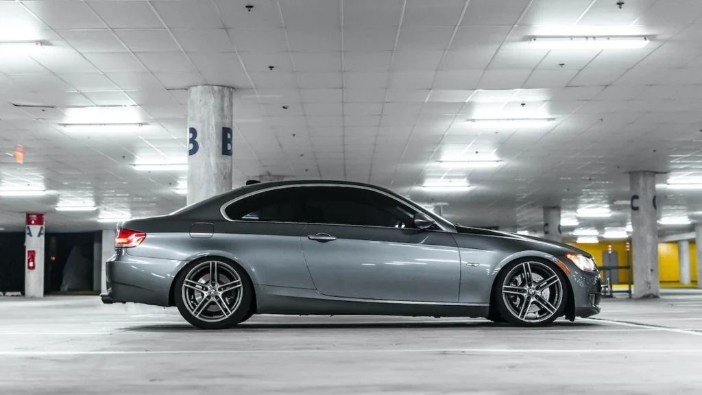 A silver car parked in a garage
