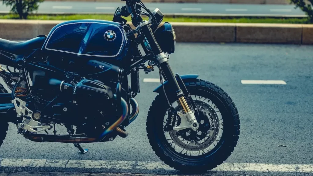 Stylish BMW motorcycle parked on city roadside reflecting urban elegance