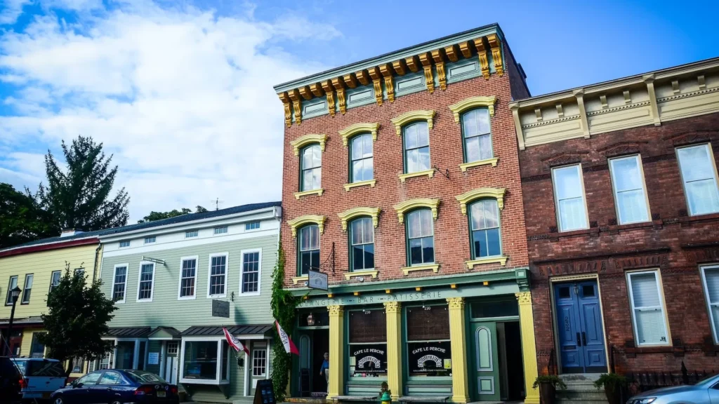 A building in Hudson, NY, with a sign on it