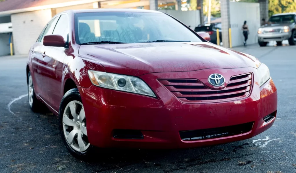 Red 2007 Toyota Camry parked in a parking lot