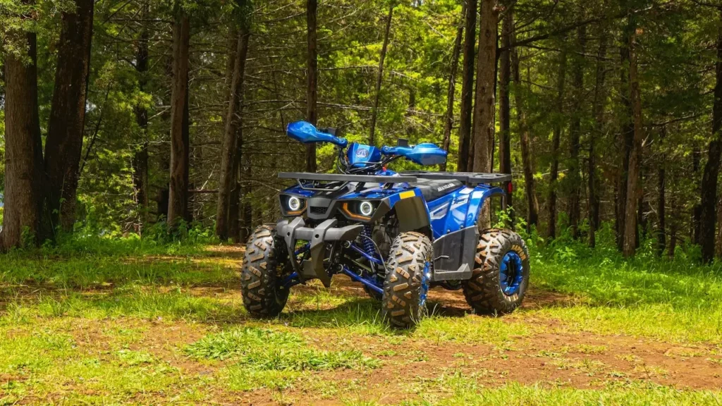 A blue ATV parked in a sunlit forest in Mexico, ideal for outdoor exploration
